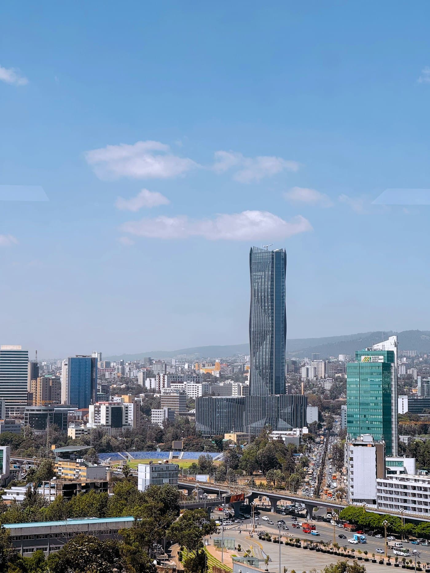 Addis Ababa skyline with a tall tower against a blue sky
